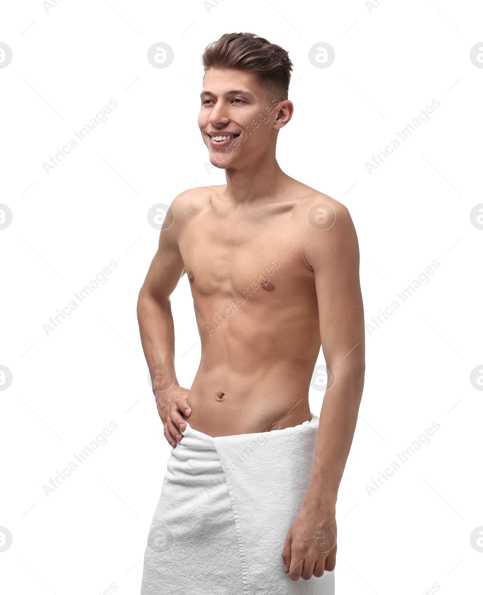 Photo of Portrait of young man with slim body in towel on white background