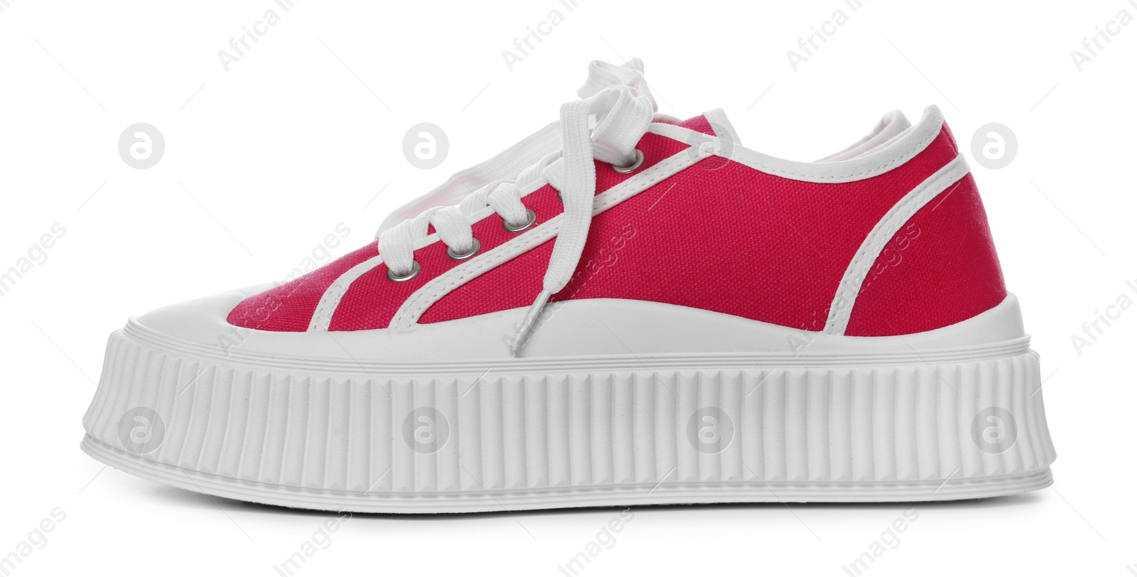 Photo of Pair of red classic old school sneakers on white background