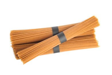 Uncooked buckwheat noodles isolated on white, top view