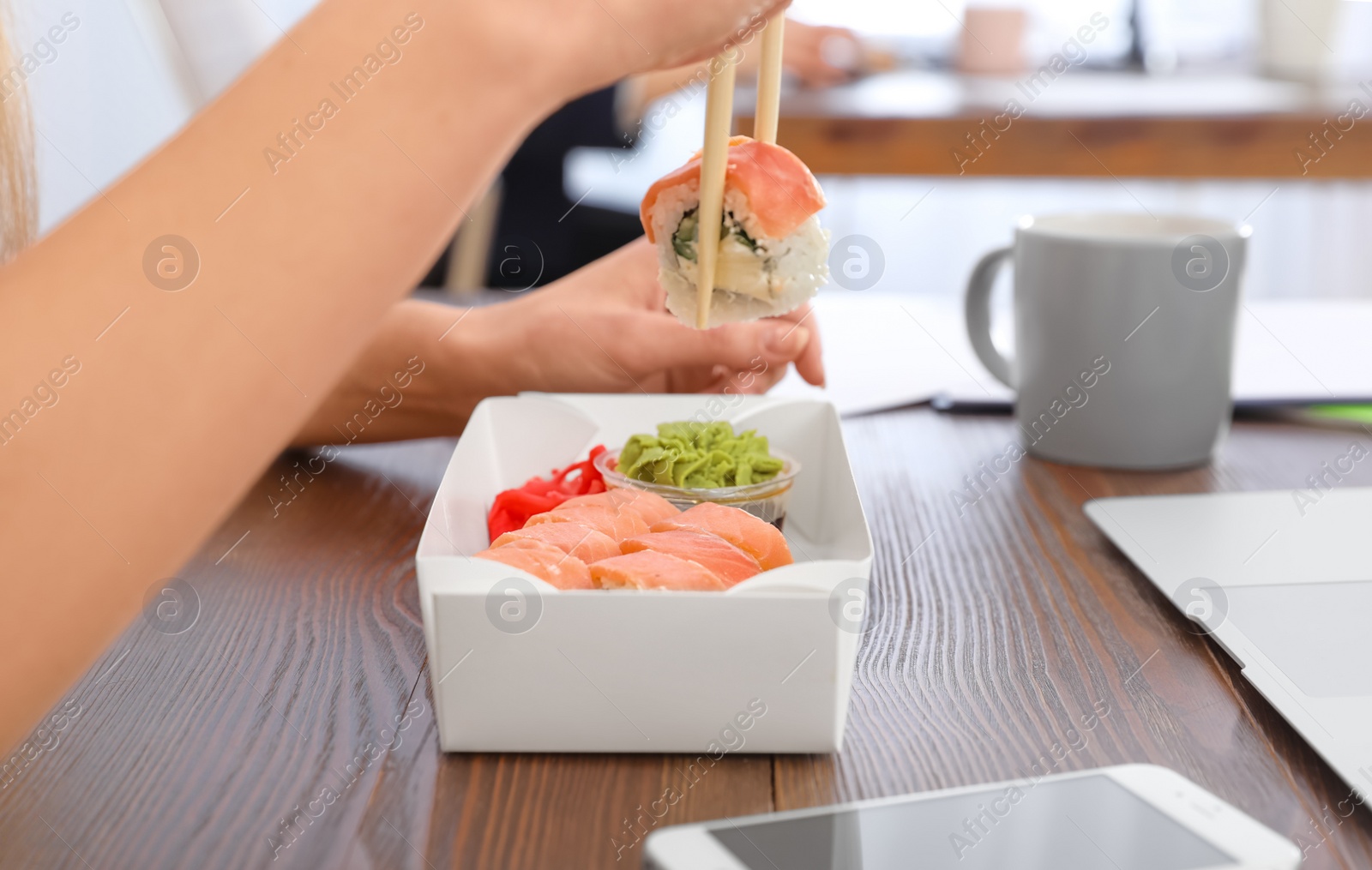 Photo of Office employee having lunch at workplace, closeup. Food delivery