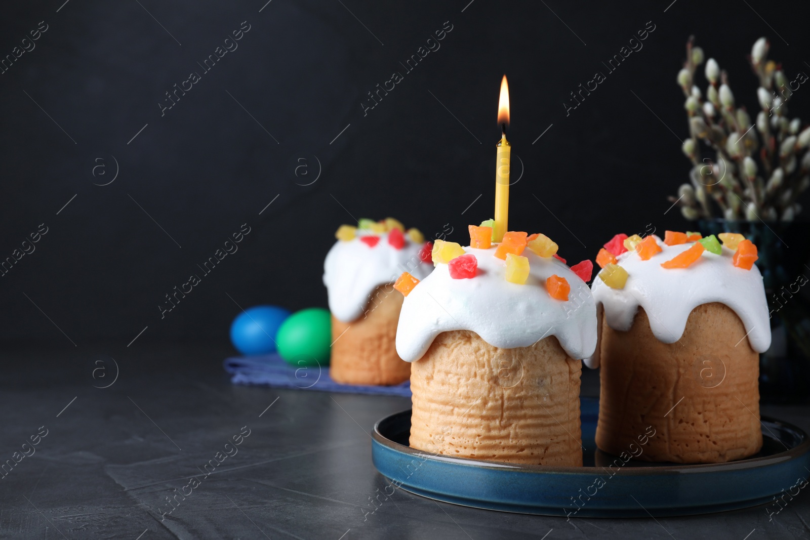 Photo of Easter cakes on dark grey table, space for text