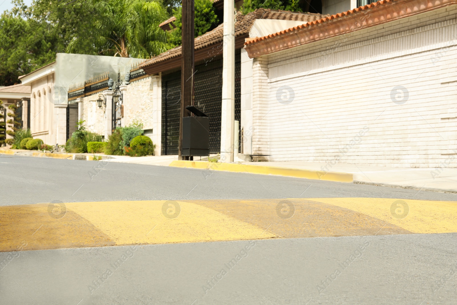 Photo of Speed bump on asphalt road in city