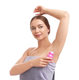 Photo of Young woman applying deodorant to armpit on white background