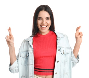 Woman with crossed fingers on white background. Superstition concept