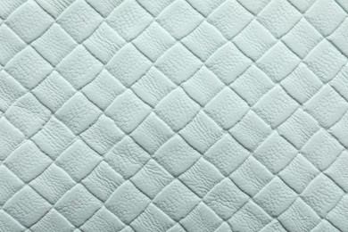 Photo of Texture of light blue leather as background, closeup