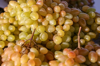 Photo of Fresh ripe juicy grapes as background, closeup