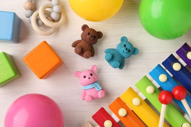 Baby song concept. Wooden xylophone and toys on table, flat lay