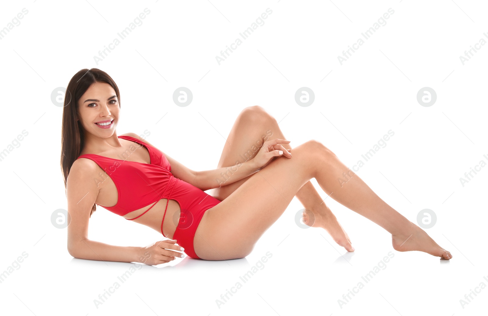 Photo of Full length portrait of attractive young woman with slim body in swimwear on white background