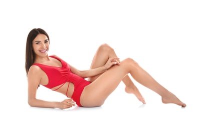 Photo of Full length portrait of attractive young woman with slim body in swimwear on white background