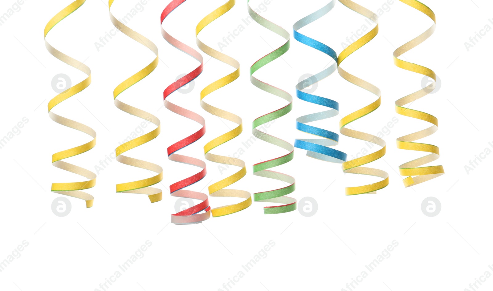 Photo of Colorful serpentine streamers on white background. Festive decor