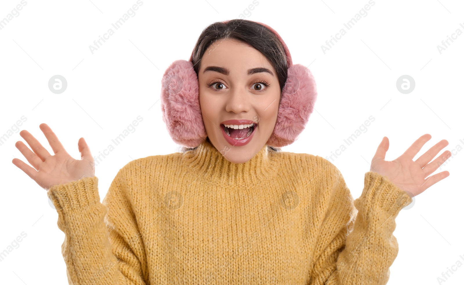 Photo of Beautiful young woman wearing earmuffs on white background