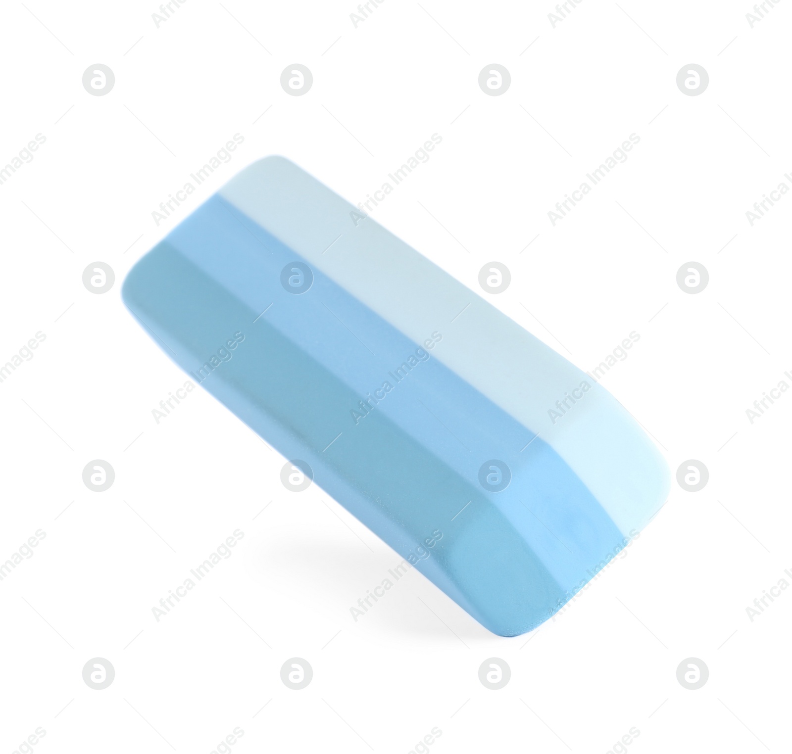 Photo of New bright eraser isolated on white. School stationery