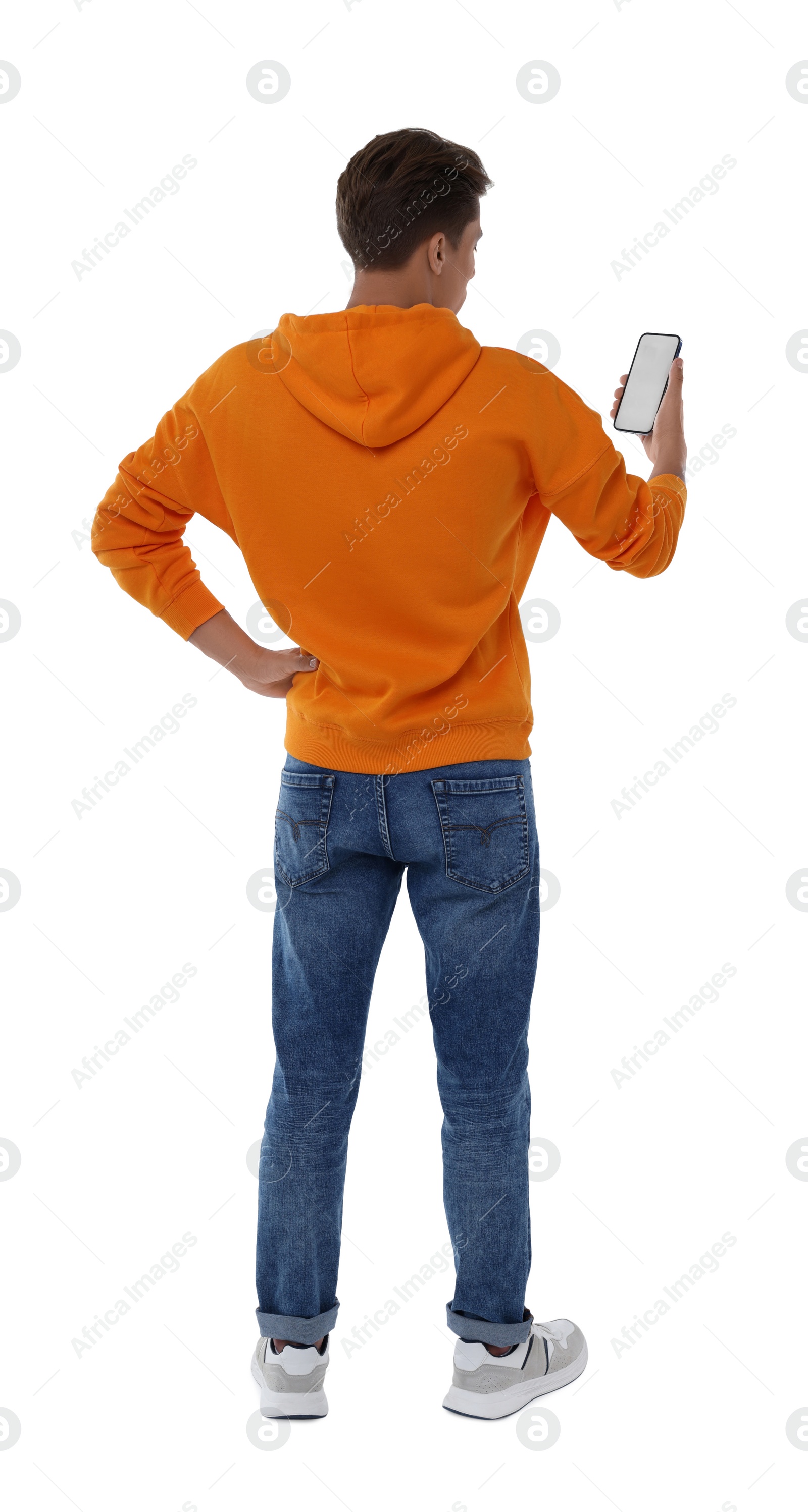 Photo of Man holding phone with blank screen on white background, back view