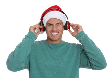 Photo of Happy man with headphones on white background. Christmas music