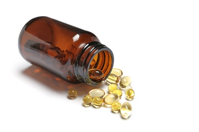 Photo of Bottle with cod liver oil capsules on white background