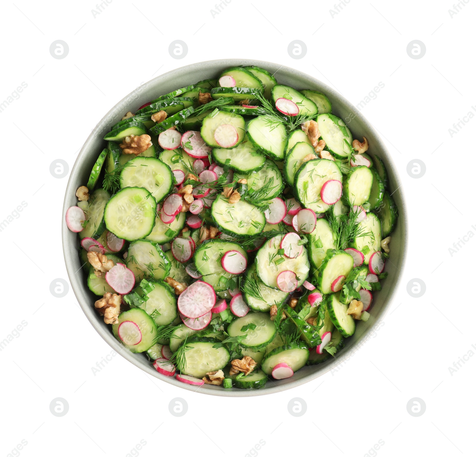 Photo of Bowl of delicious cucumber salad isolated on white, top view