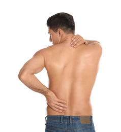 Photo of Man suffering from pain in back on white background. Visiting orthopedist