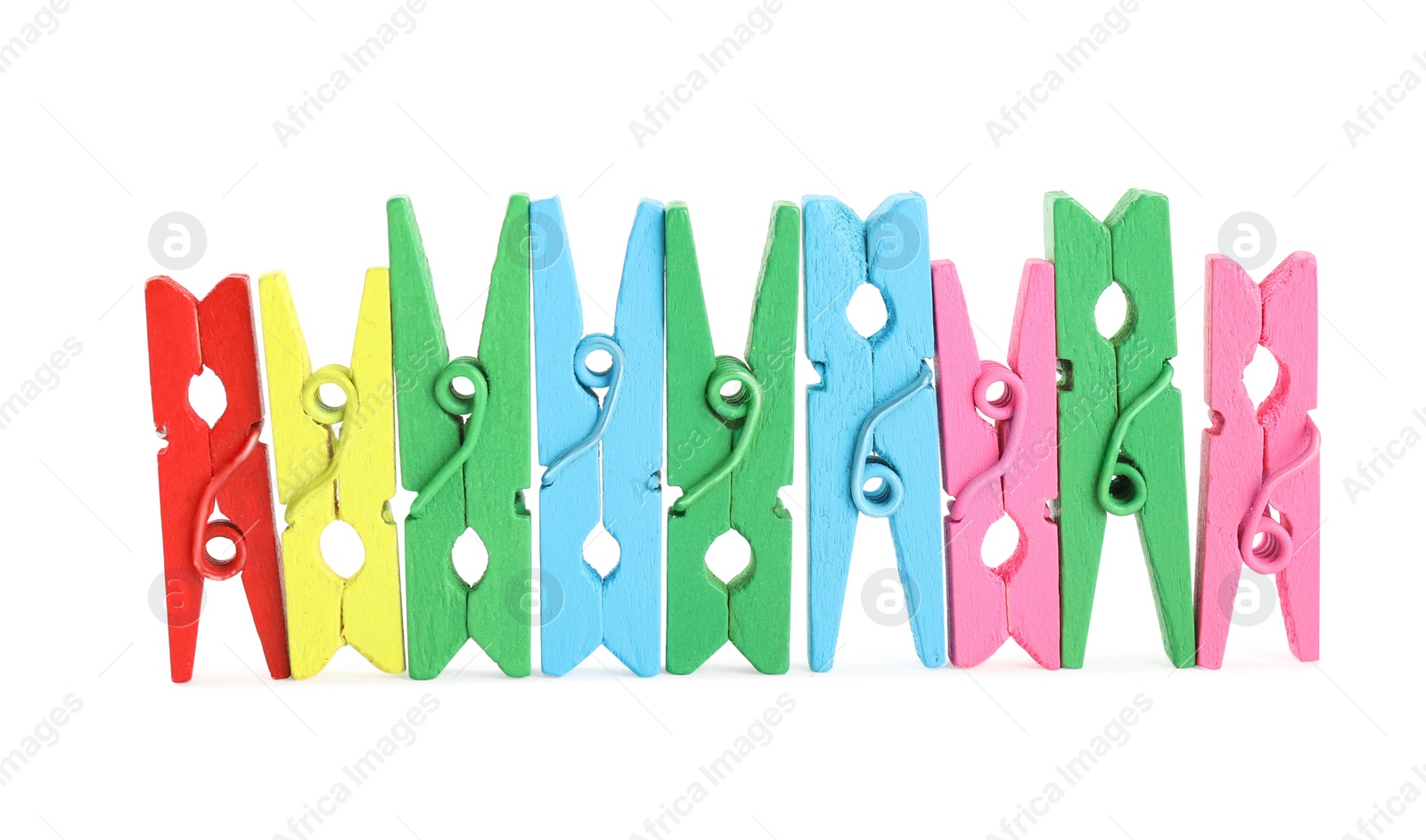 Photo of Many colorful wooden clothespins on white background