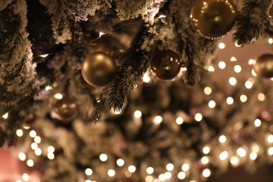 Closeup view of beautifully decorated Christmas tree indoors