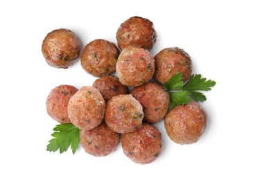 Photo of Tasty cooked meatballs with parsley on white background, top view