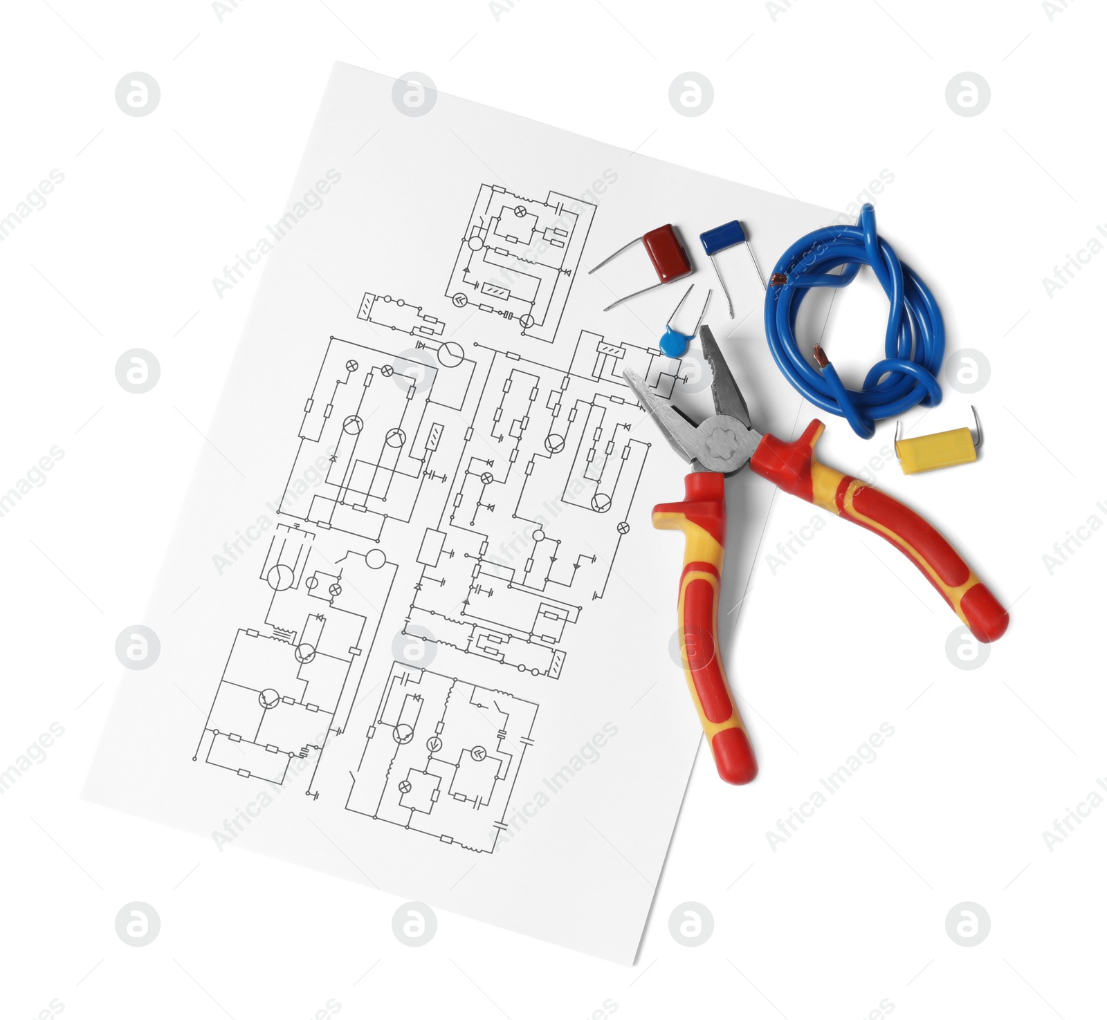 Photo of Wiring diagram, wires and pliers isolated on white, top view