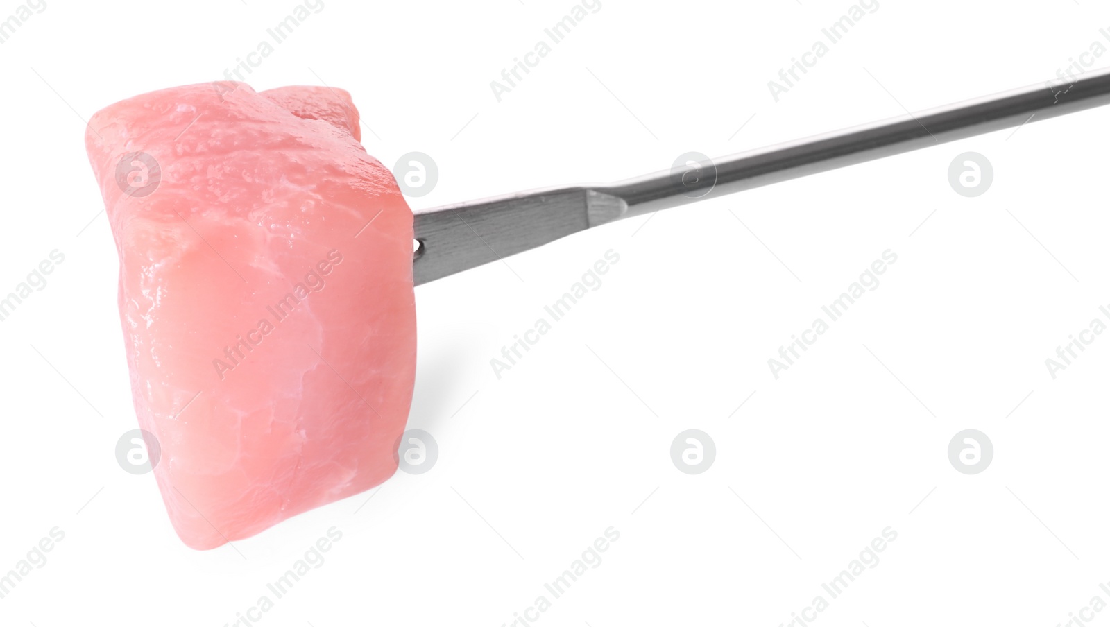 Photo of Fondue fork with piece of raw meat isolated on white