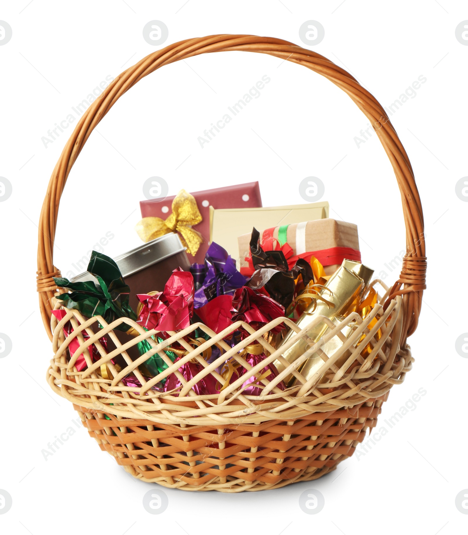 Photo of Wicker basket full of gifts isolated on white