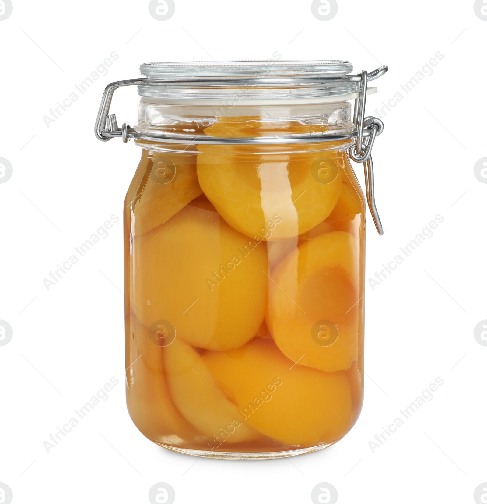 Photo of Glass jar with canned peach halves isolated on white