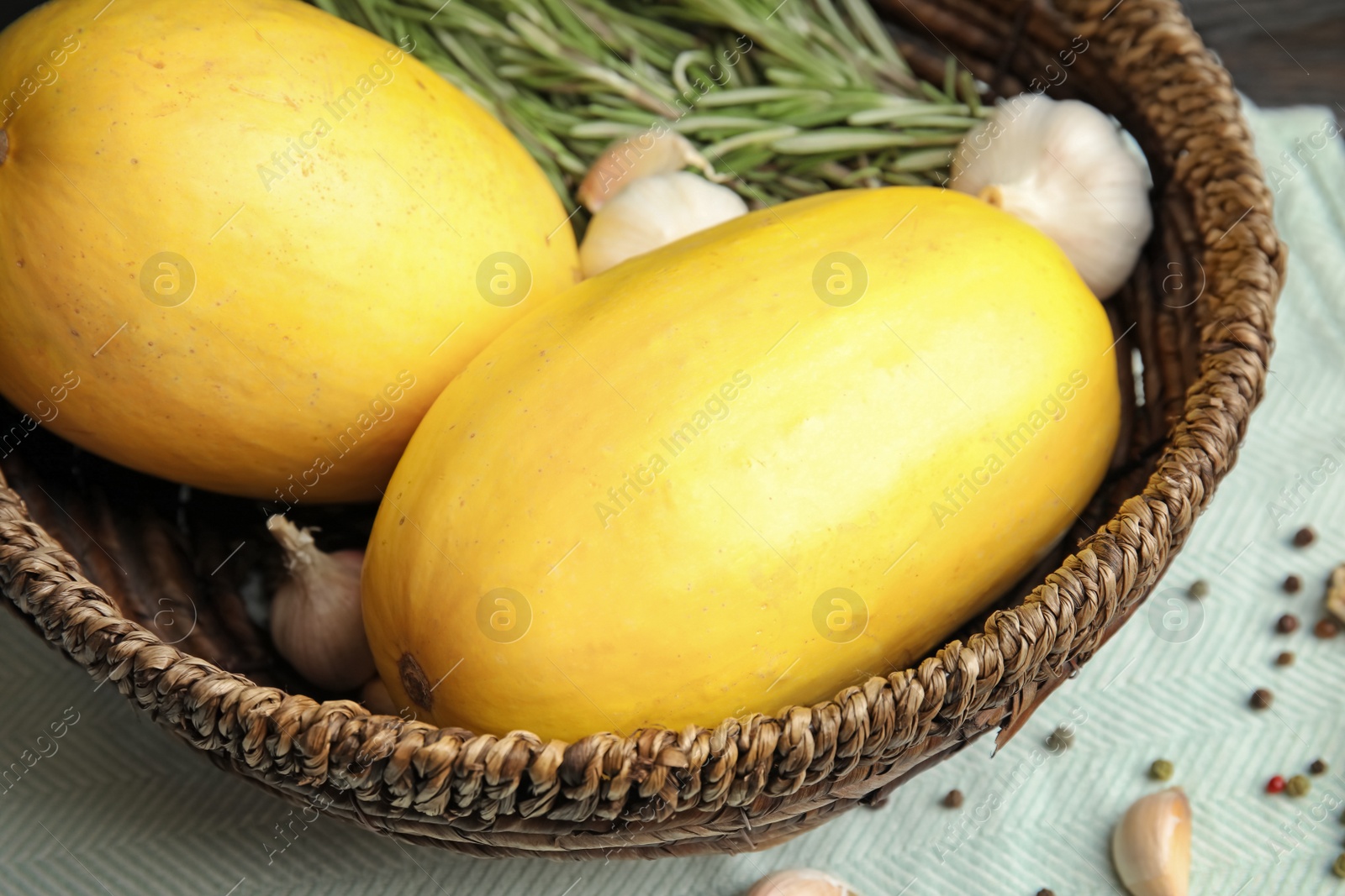 Photo of Basket with ripe spaghetti squashes on table