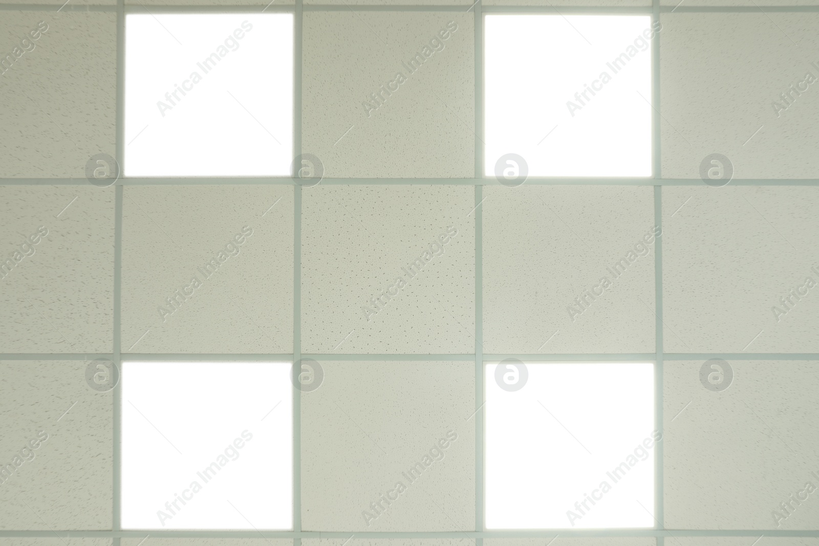 Photo of White ceiling with lighting in office room, bottom view