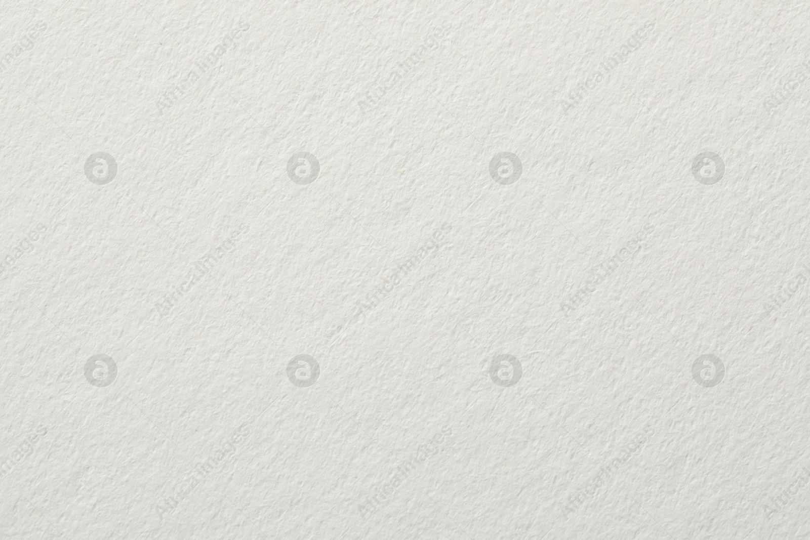 Photo of Texture of white paper sheet as background, closeup