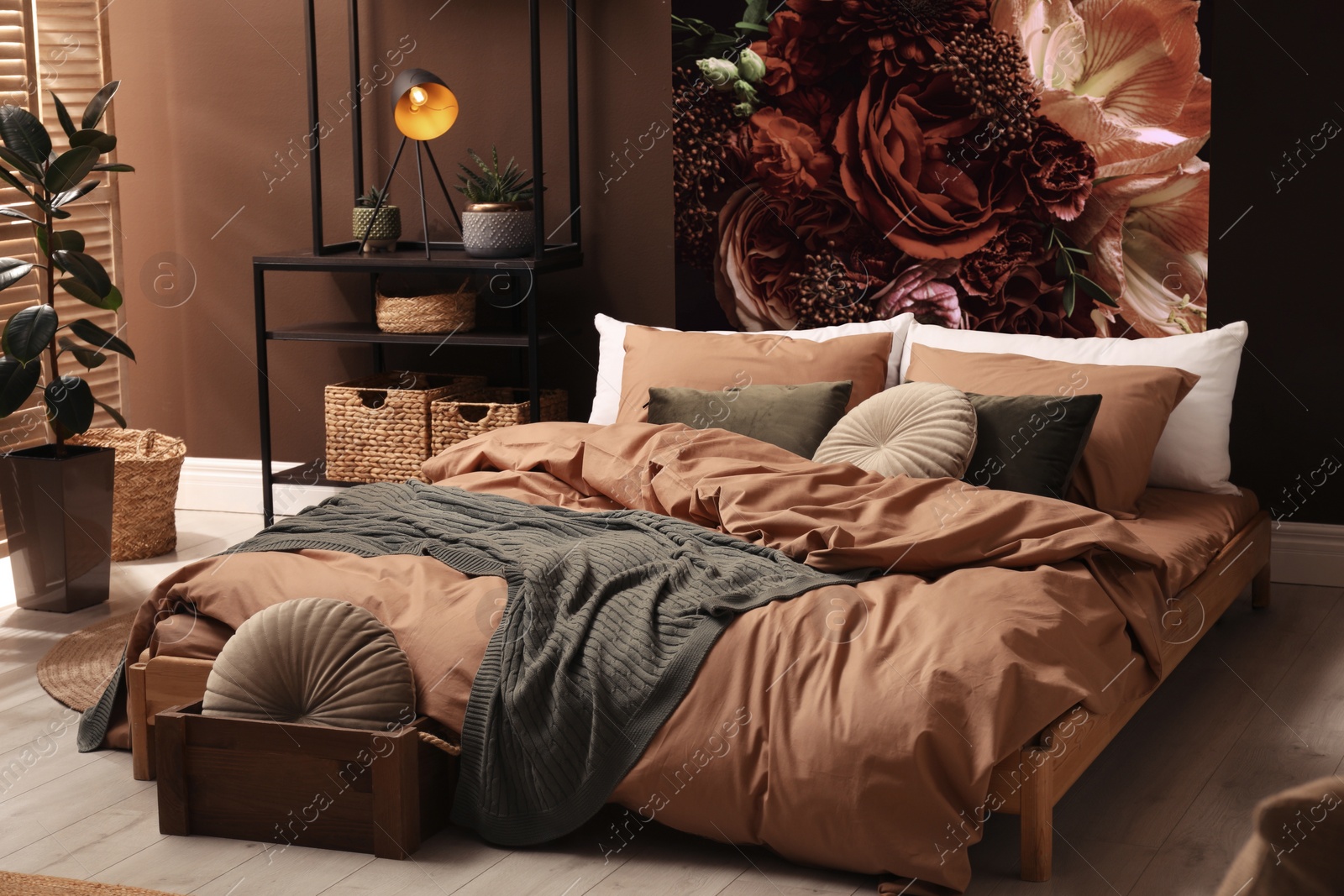 Image of Cozy bedroom interior with comfortable furniture and beautiful floral wallpapers