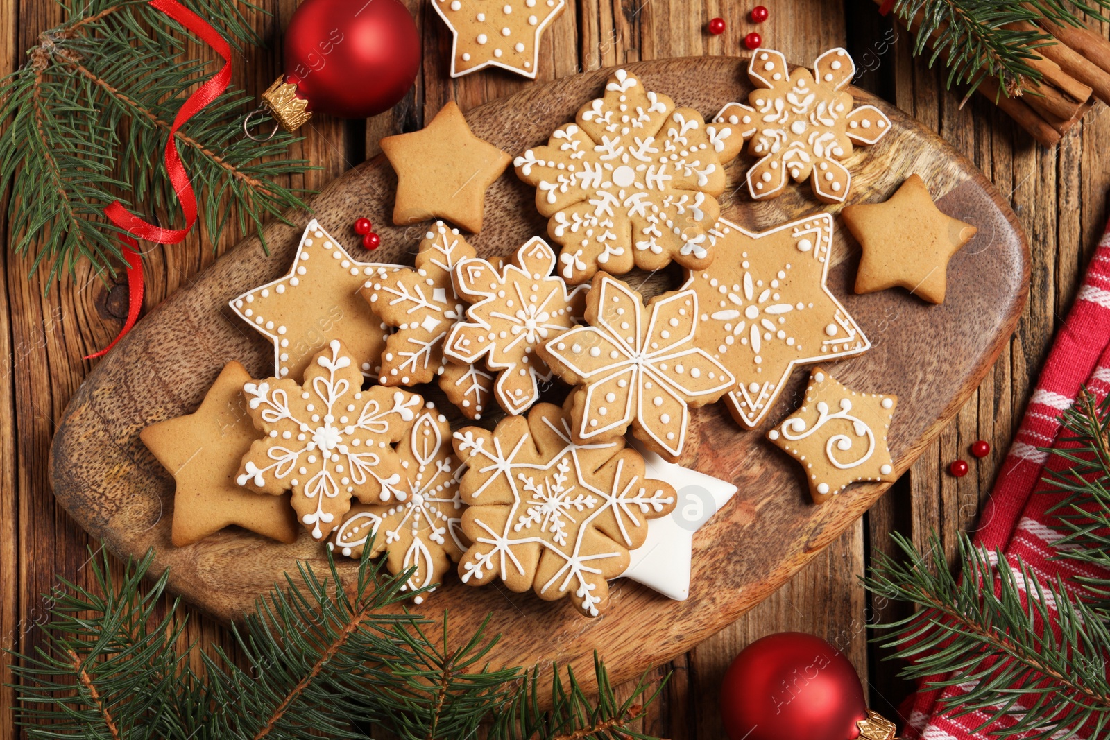 Photo of Flat lay composition with tasty Christmas cookies on wooden table