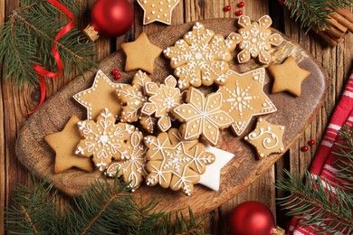 Flat lay composition with tasty Christmas cookies on wooden table