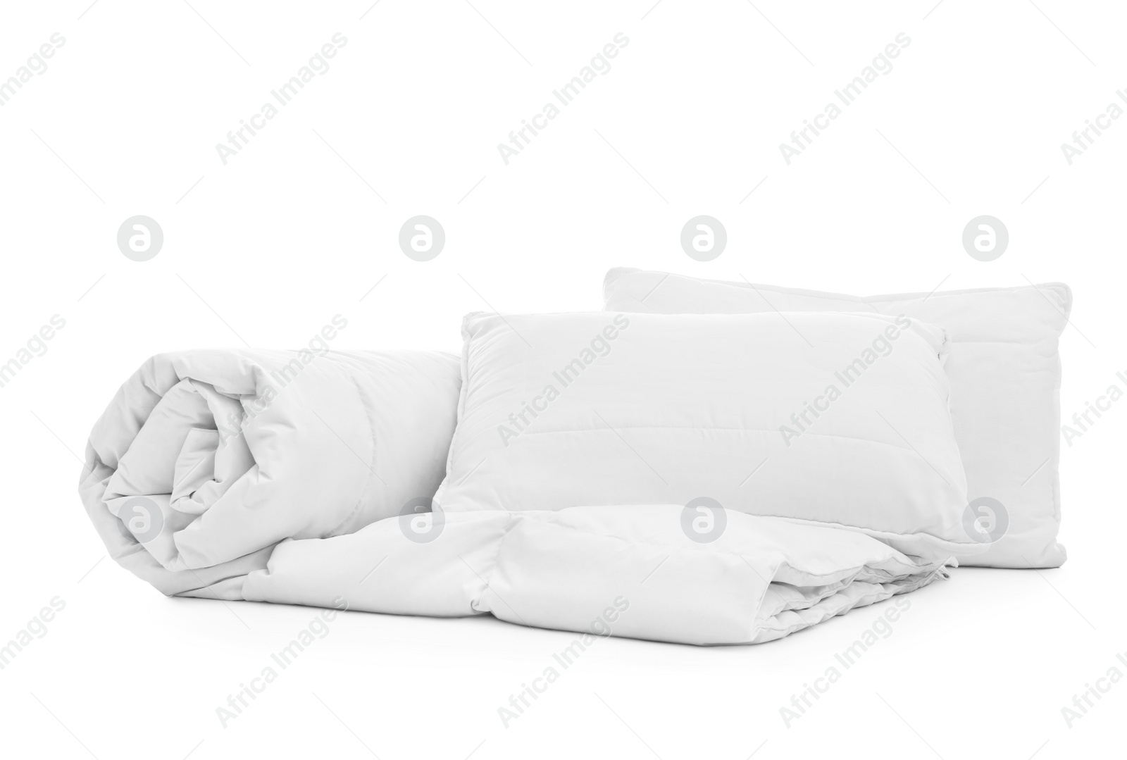 Photo of Soft blanket with pillows on white background