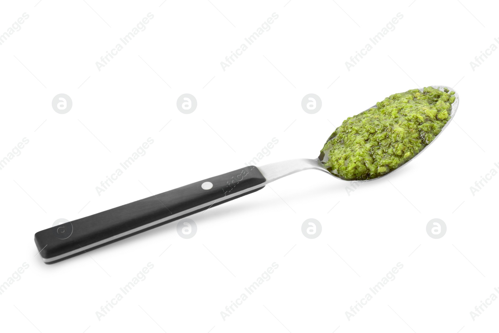 Photo of Spoon with delicious pesto sauce isolated on white