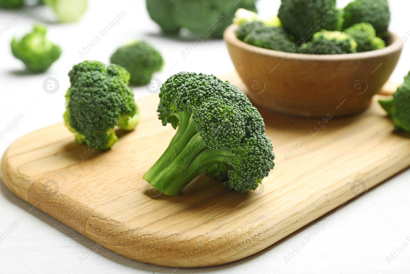 Photo of Composition with fresh broccoli on light table, closeup