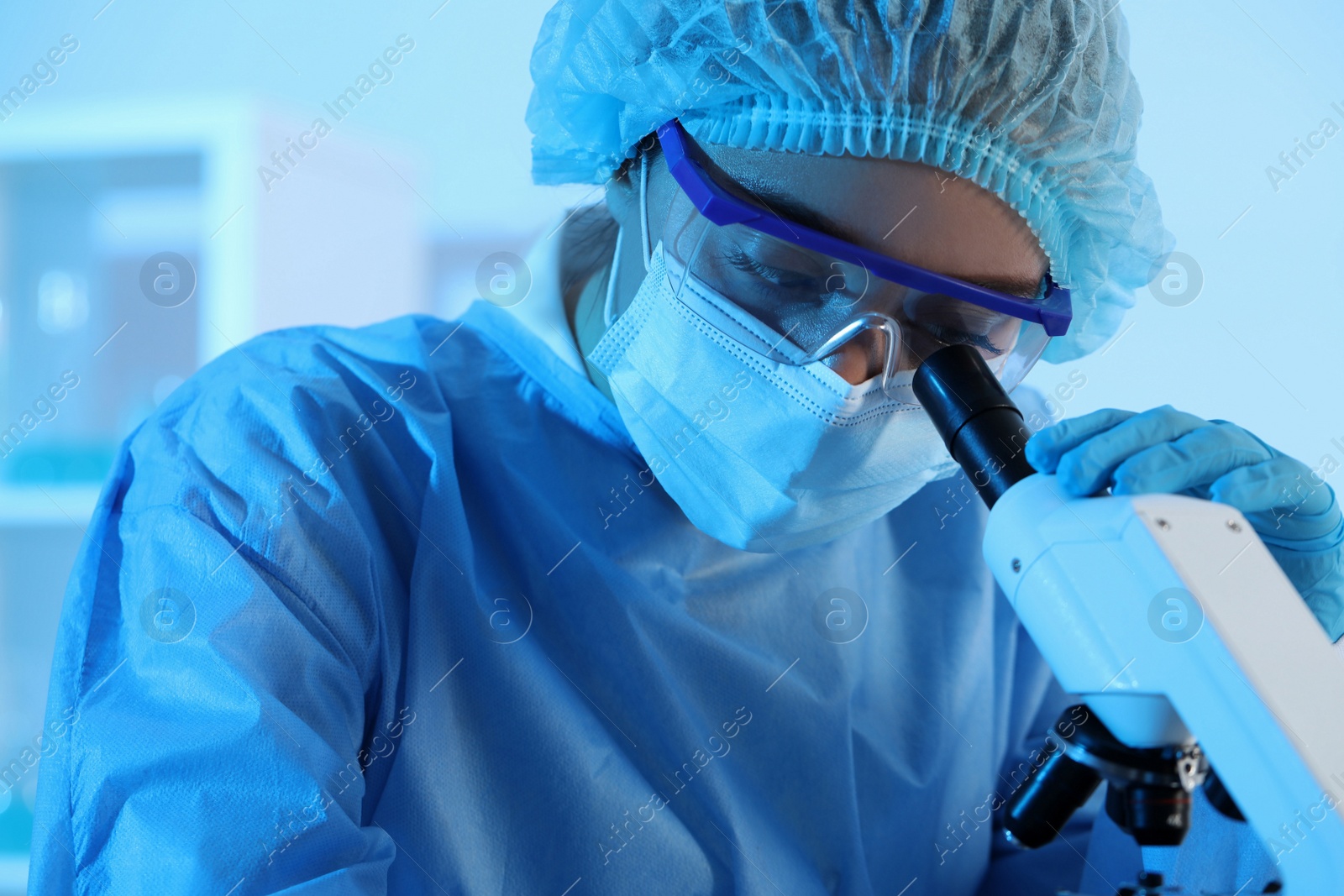 Photo of Scientist working with microscope in laboratory. Medical research