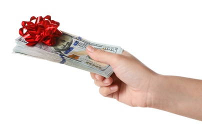 Photo of Woman holding dollar banknotes with bow on white background, closeup