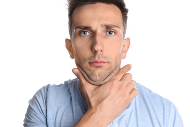 Young man with double chin on white background