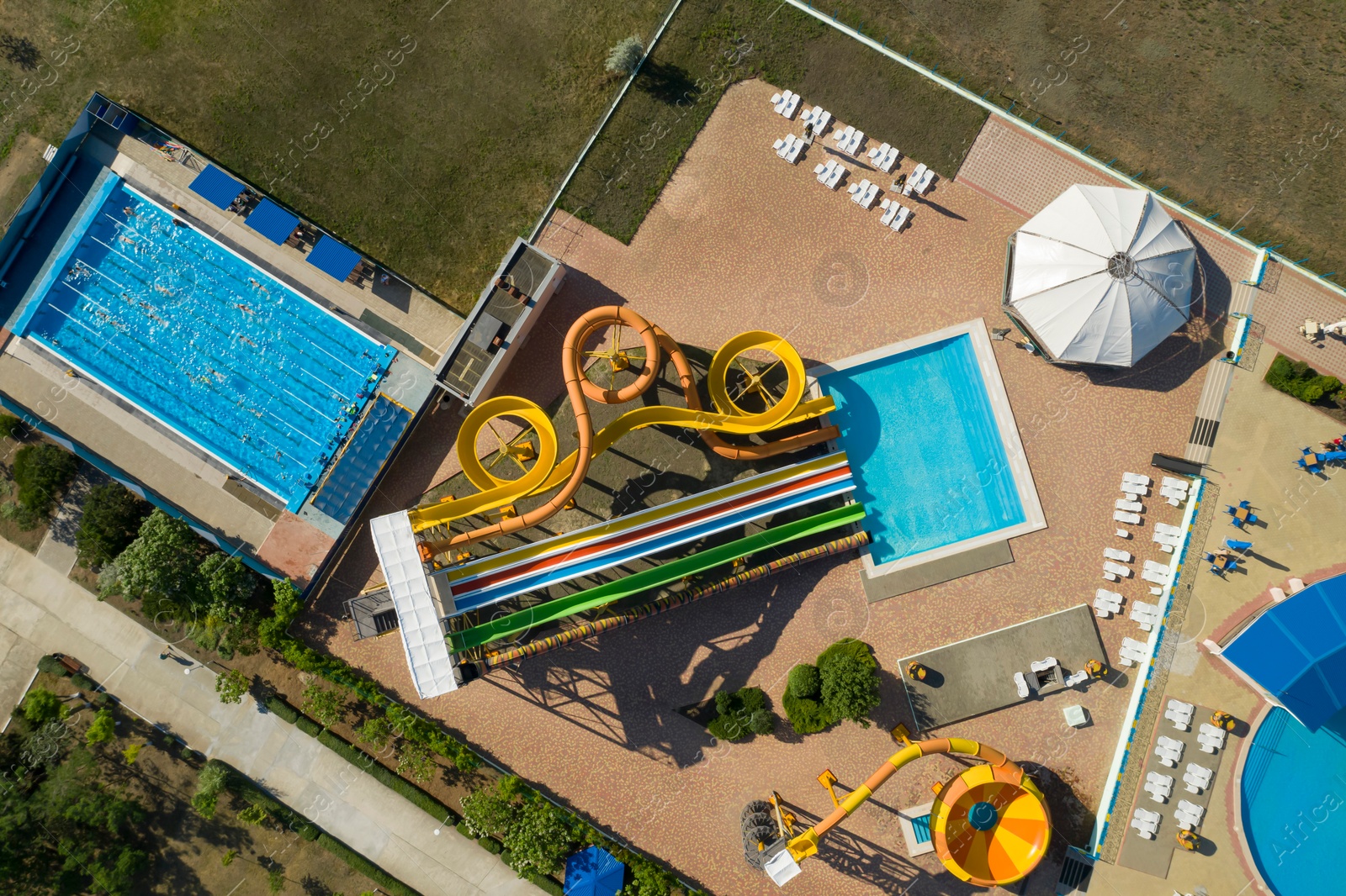 Image of Aerial view of water park on sunny day