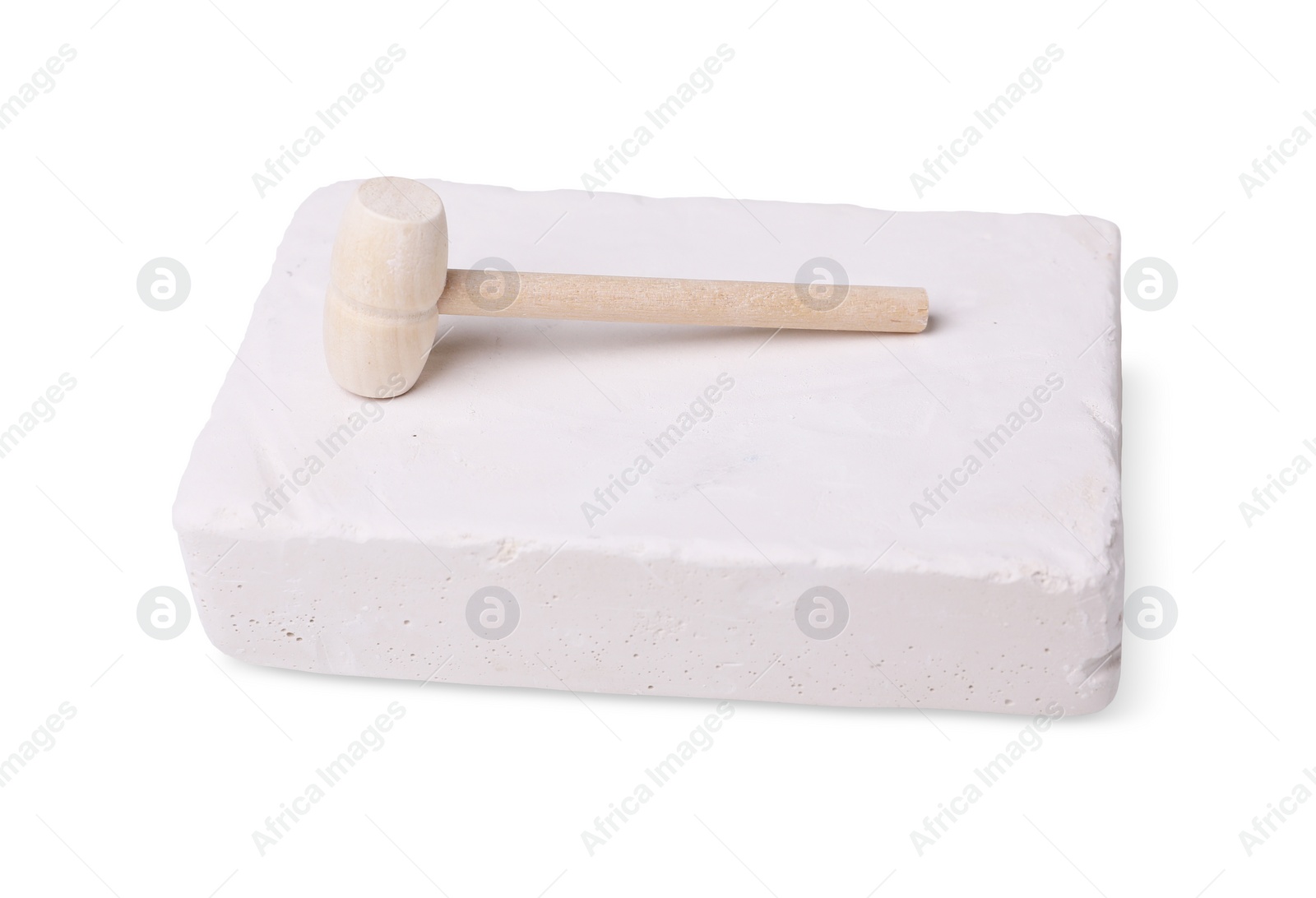 Photo of Educational toy for motor skills development. Excavation kit (plaster and wooden mallet) on white background