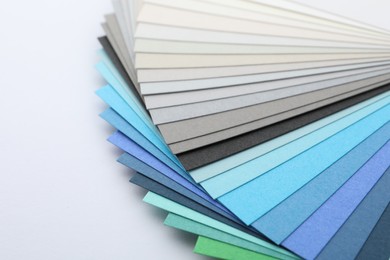 Photo of Color palette samples on white background, closeup