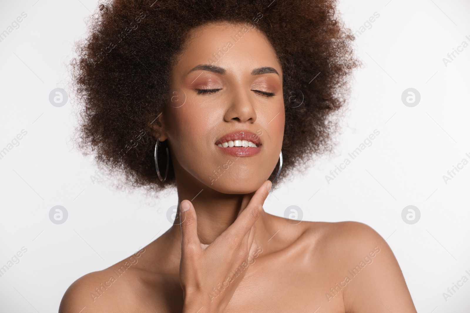 Photo of Portrait of beautiful young woman with glamorous makeup on white background