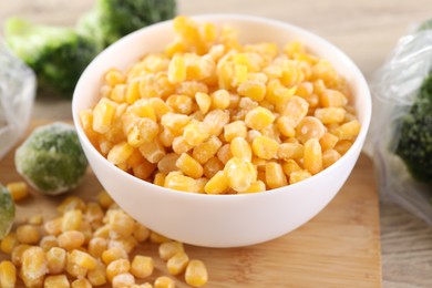 Frozen vegetables on wooden table, closeup view