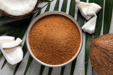 Photo of Flat lay composition with natural coconut sugar on grey table