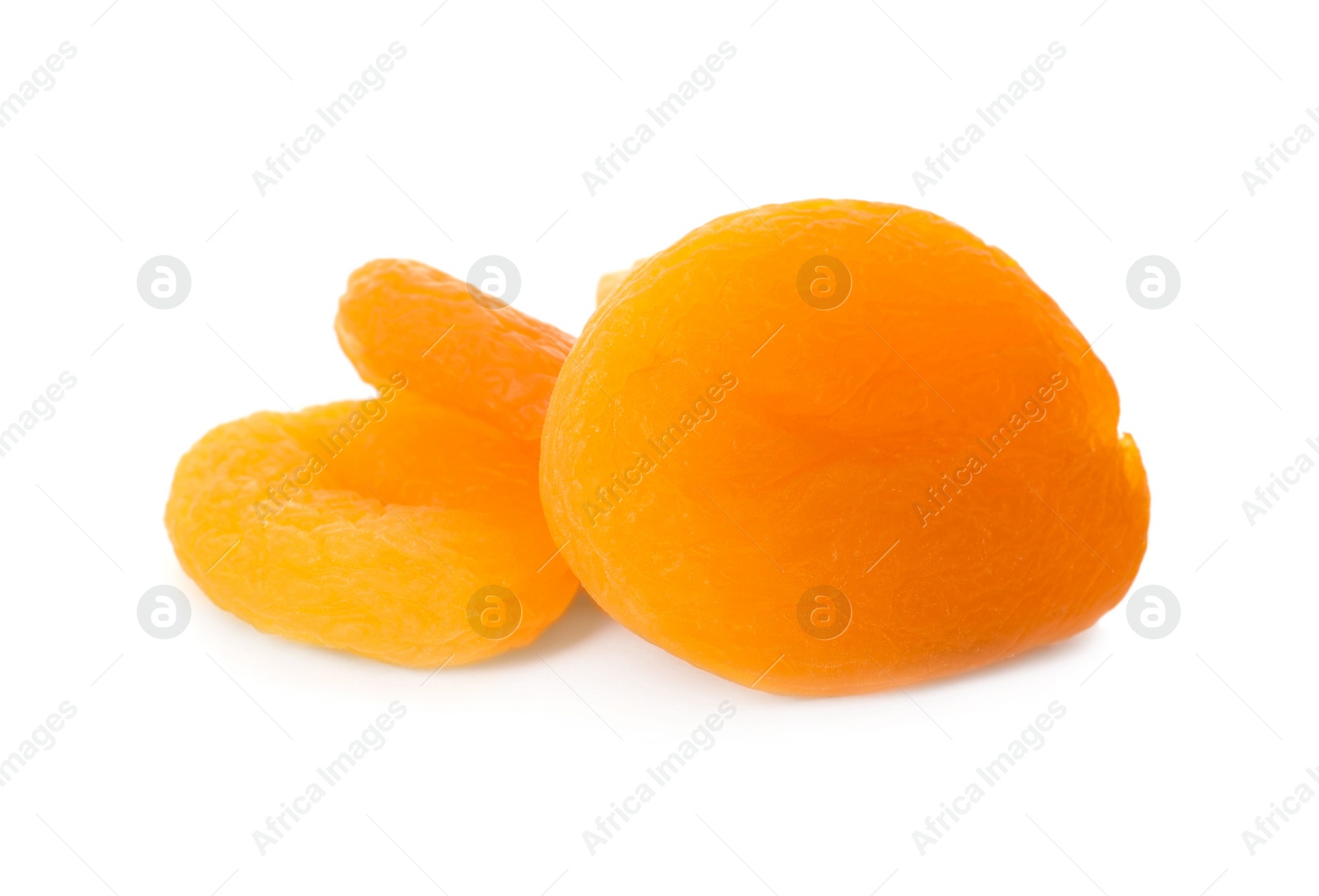 Photo of Tasty apricots on white background. Dried fruits