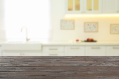 Image of Empty wooden table and blurred view of stylish kitchen interior. Mockup for design