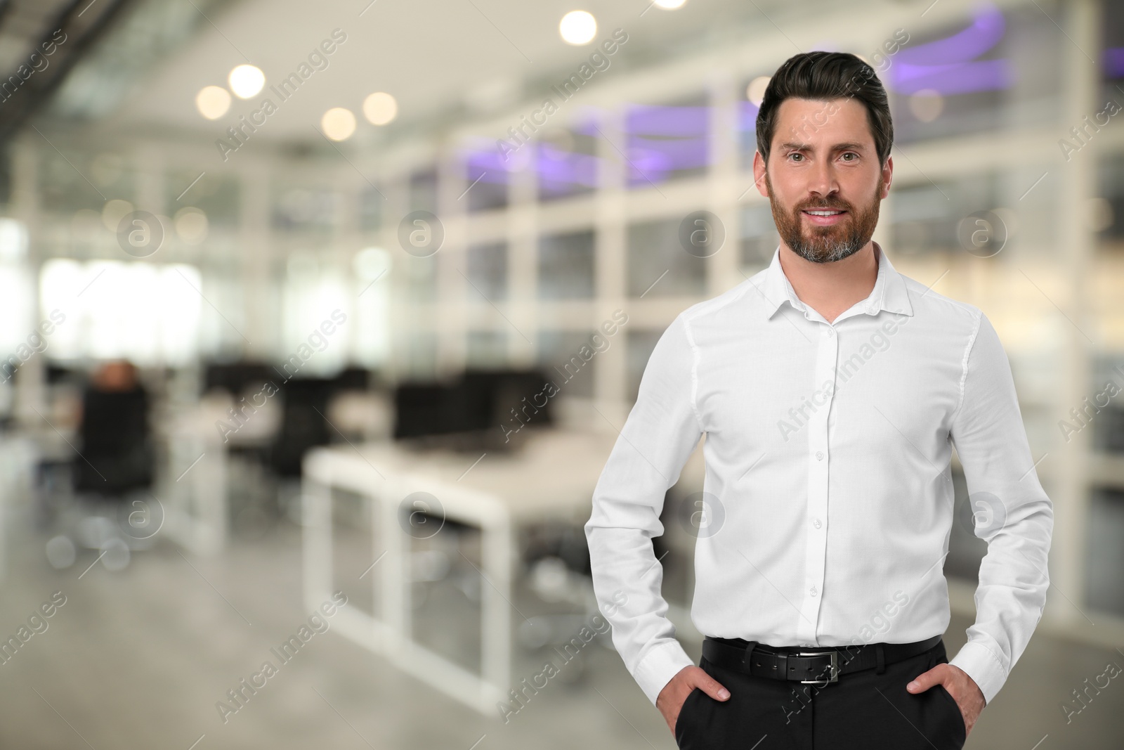 Image of Portrait of handsome confident man in office, space for text