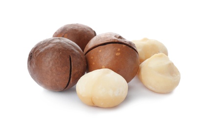 Photo of Pile of organic Macadamia nuts on white background